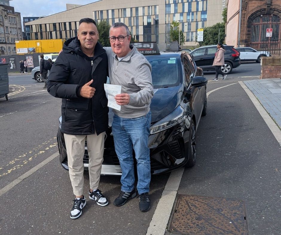 A Pull Up instructor with a pupil who has just passed their driving test
