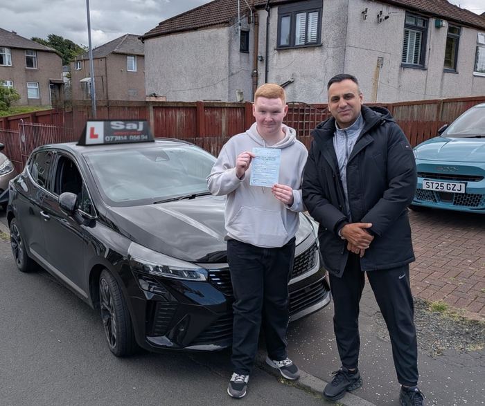Pupil and instructor celebrating a test pass