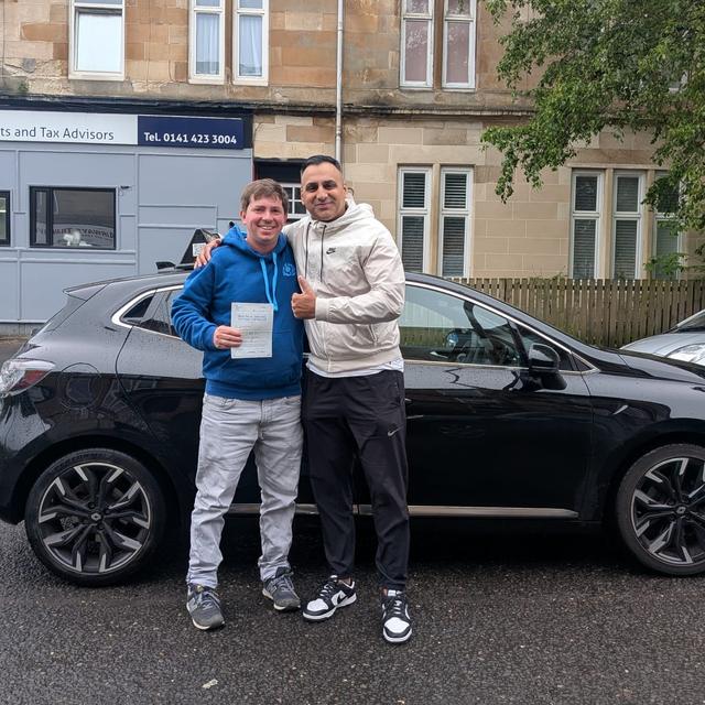Pupil and instructor with pass certificate